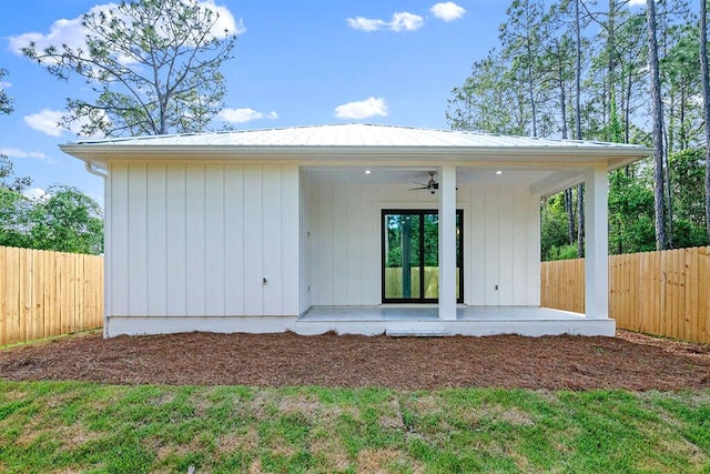 42 Central 8th St, Santa Rosa Beach, FL 32459 - rear view of property with fence, a patio, ceiling fan, and metal roof