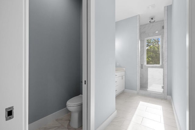 42 Central 8th St, Santa Rosa Beach, FL 32459 - bathroom featuring vanity, marble finish floor, toilet, baseboards, and a shower stall