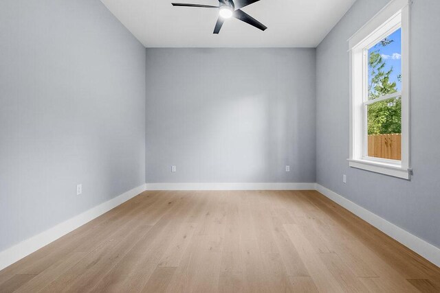 42 Central 8th St, Santa Rosa Beach, FL 32459 - unfurnished room featuring light wood-style floors, a ceiling fan, and baseboards