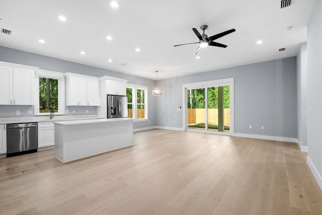 42 Central 8th St, Santa Rosa Beach, FL 32459 - kitchen featuring baseboards, a wealth of natural light, stainless steel appliances, and open floor plan