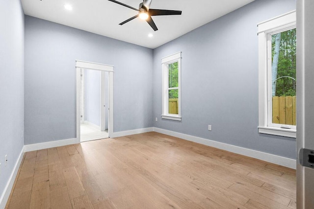 42 Central 8th St, Santa Rosa Beach, FL 32459 - spare room featuring baseboards, a ceiling fan, light wood-style flooring, and a healthy amount of sunlight