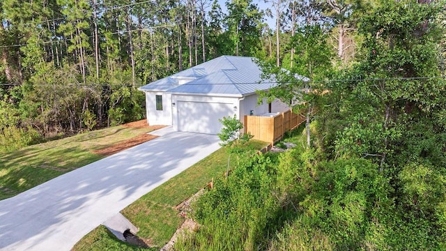 42 Central 8th St, Santa Rosa Beach, FL 32459 - garage featuring fence and driveway