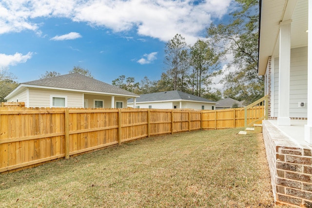 view of yard featuring a fenced backyard