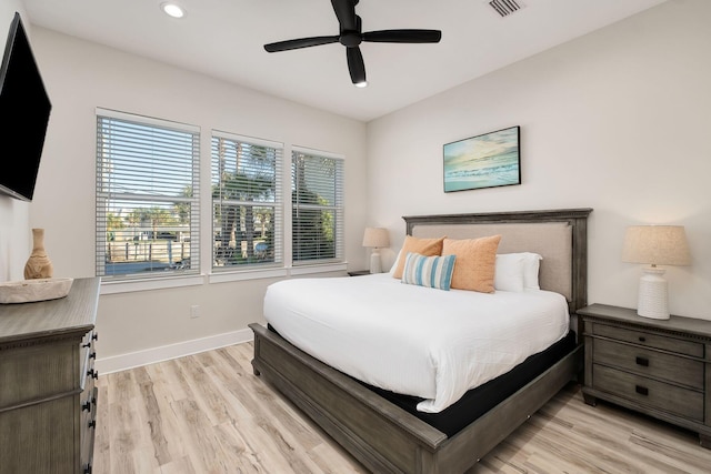 bedroom featuring baseboards, light wood-style flooring, recessed lighting, and a ceiling fan