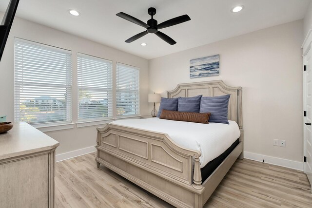 bedroom with baseboards, light wood-style flooring, recessed lighting, and a ceiling fan