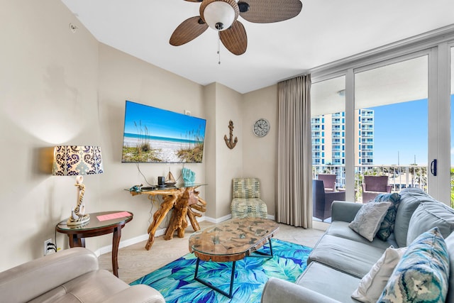 4207 Indian Bayou Trl Unit 2501, Destin, FL 32541 - living area featuring a wall of windows, baseboards, and a ceiling fan