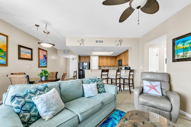 4207 Indian Bayou Trl Unit 2501, Destin, FL 32541 - living room featuring baseboards, ceiling fan, and visible vents