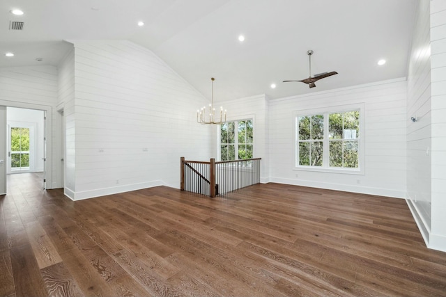 unfurnished living room featuring high vaulted ceiling, visible vents, baseboards, wood finished floors, and ceiling fan with notable chandelier