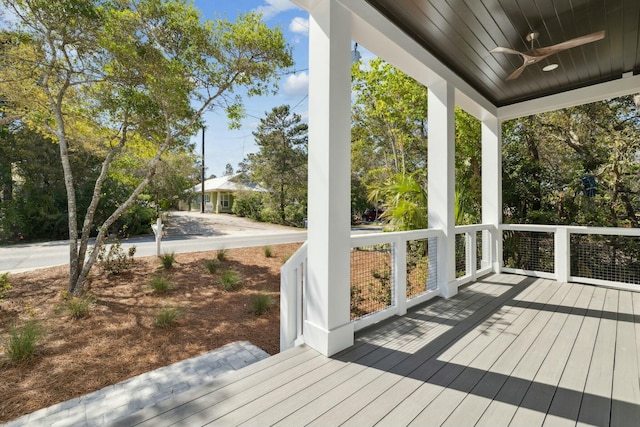 wooden deck with ceiling fan and a porch
