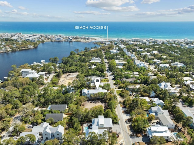 drone / aerial view with a residential view and a water view