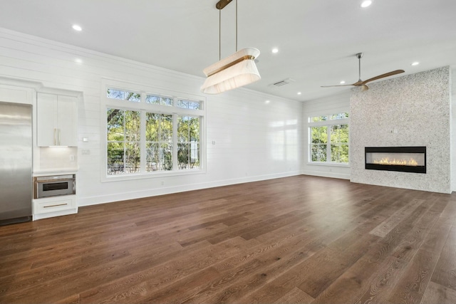 unfurnished living room featuring recessed lighting, a large fireplace, dark wood-style flooring, a ceiling fan, and visible vents