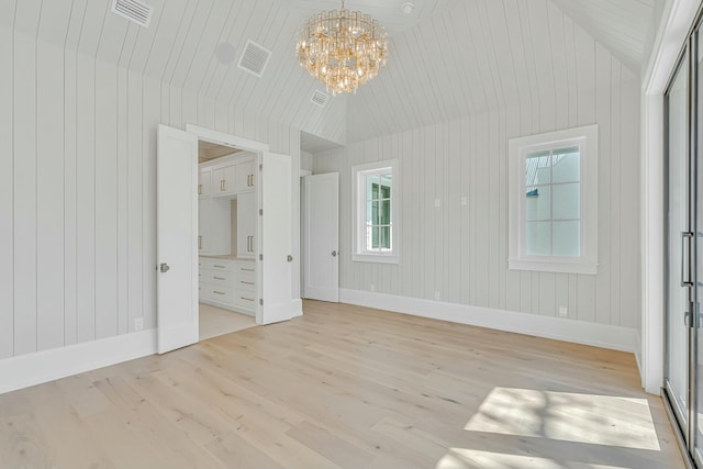 unfurnished bedroom featuring visible vents, light wood-style flooring, and baseboards