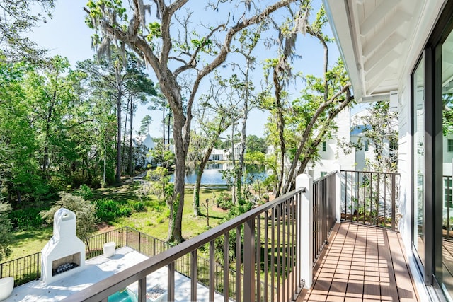 balcony featuring a water view