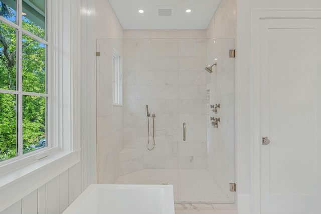 full bathroom with recessed lighting and a stall shower