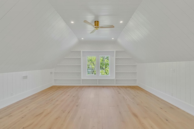 bonus room with wood-type flooring, ceiling fan, and vaulted ceiling