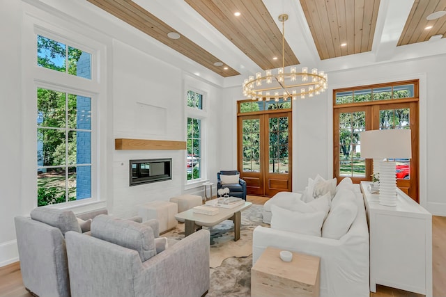 living area with plenty of natural light and beamed ceiling