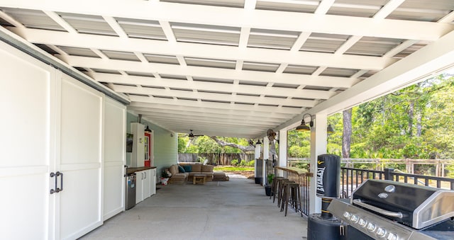 view of patio / terrace featuring a grill and fence