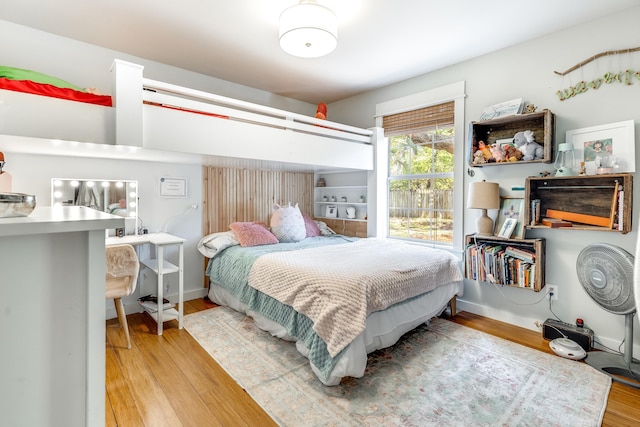 bedroom with wood finished floors