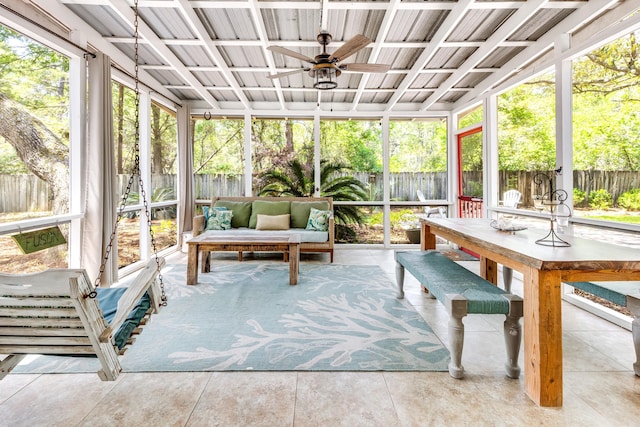 sunroom / solarium with ceiling fan and outdoor lounge area