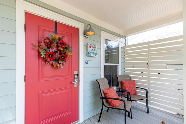 entrance to property featuring covered porch