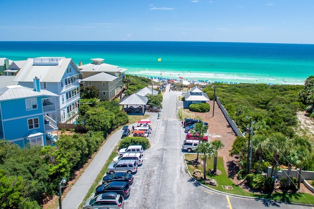 bird's eye view featuring a beach view and a water view