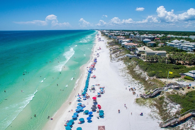 birds eye view of property with a beach view and a water view