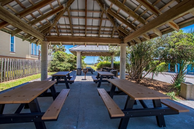 view of patio / terrace featuring fence, a gazebo, and outdoor dining space