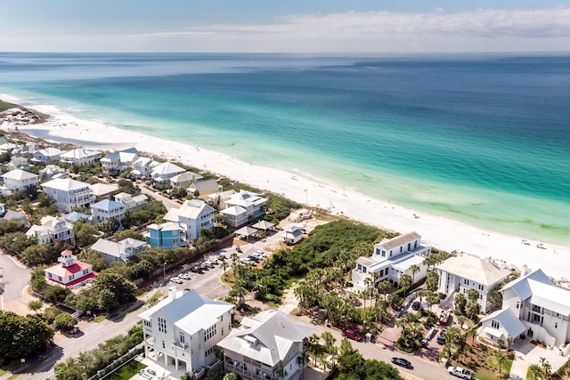 bird's eye view featuring a beach view and a water view
