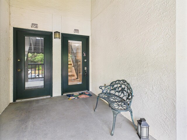210 Southlake Ct Unit 210, Niceville, FL 32578 - doorway to property featuring stucco siding