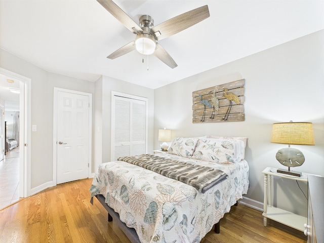210 Southlake Ct Unit 210, Niceville, FL 32578 - bedroom with a closet, wood finished floors, baseboards, and ceiling fan