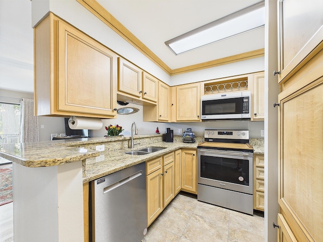 210 Southlake Ct Unit 210, Niceville, FL 32578 - kitchen featuring stainless steel appliances, a sink, light brown cabinets, and light stone countertops