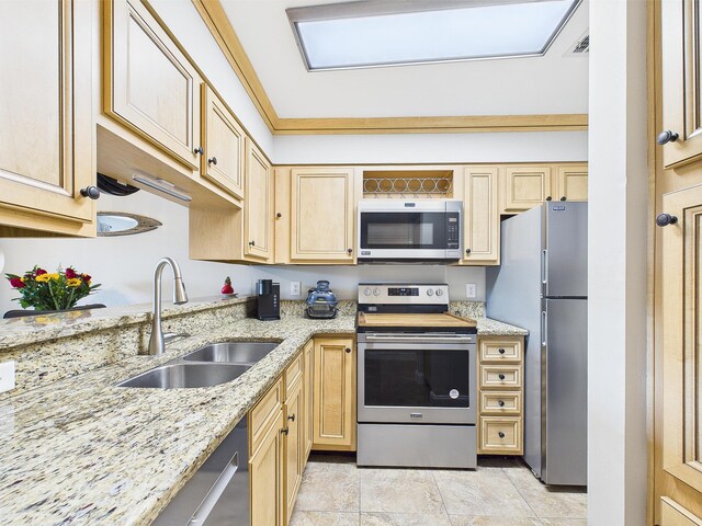 210 Southlake Ct Unit 210, Niceville, FL 32578 - kitchen featuring appliances with stainless steel finishes, a sink, light brown cabinetry, and light stone counters