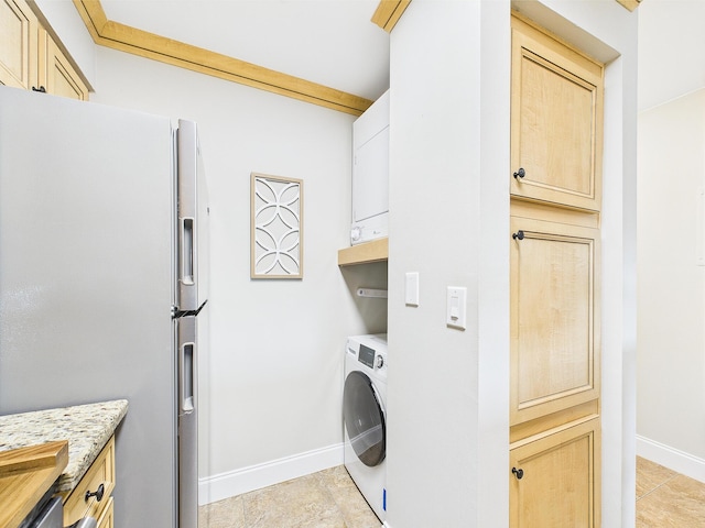210 Southlake Ct Unit 210, Niceville, FL 32578 - clothes washing area with washer / clothes dryer, baseboards, and light tile patterned floors