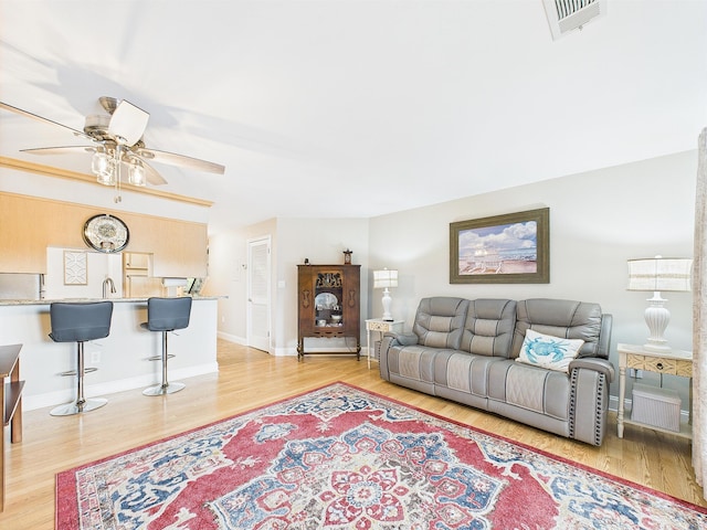 210 Southlake Ct Unit 210, Niceville, FL 32578 - living area with ceiling fan, light wood-style floors, and baseboards