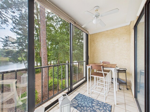 210 Southlake Ct Unit 210, Niceville, FL 32578 - sunroom featuring ceiling fan and a water view