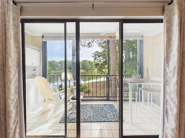 210 Southlake Ct Unit 210, Niceville, FL 32578 - doorway to outside with tile patterned floors and a water view