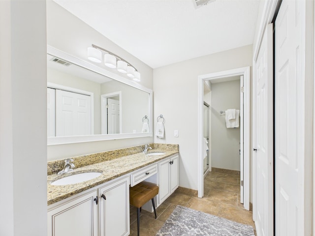 210 Southlake Ct Unit 210, Niceville, FL 32578 - bathroom featuring double vanity and baseboards