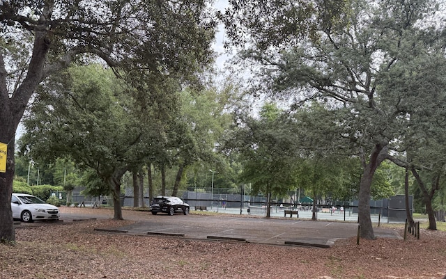 210 Southlake Ct Unit 210, Niceville, FL 32578 - view of community featuring fence and uncovered parking