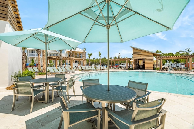 LOT39 String Lily Cv, Santa Rosa Beach, FL 32459 - community pool featuring a pergola, a patio area, and outdoor dining area