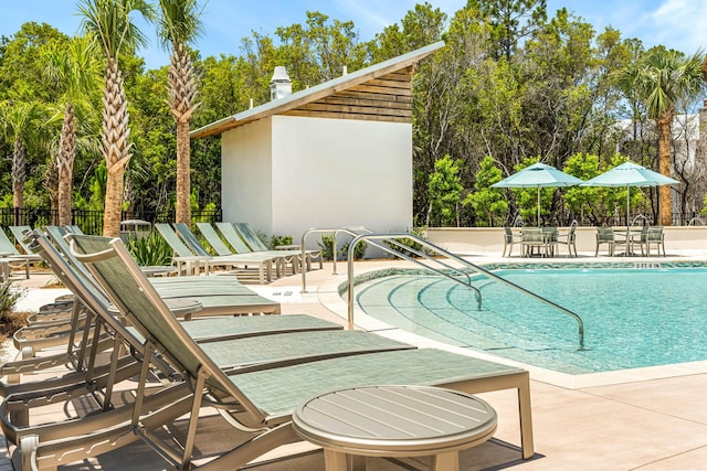 LOT39 String Lily Cv, Santa Rosa Beach, FL 32459 - community pool with a patio area and view of scattered trees