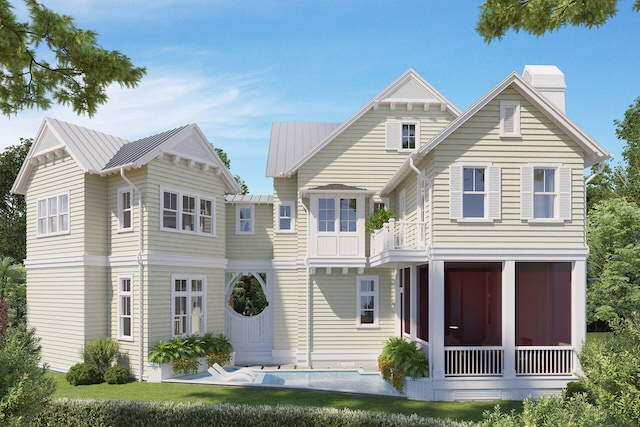 LOT39 String Lily Cv, Santa Rosa Beach, FL 32459 - view of front of house with a balcony, a chimney, metal roof, and a standing seam roof