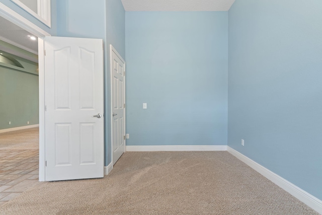 7008 Turnberry Cir, Navarre, FL 32566 - unfurnished bedroom with baseboards and light carpet