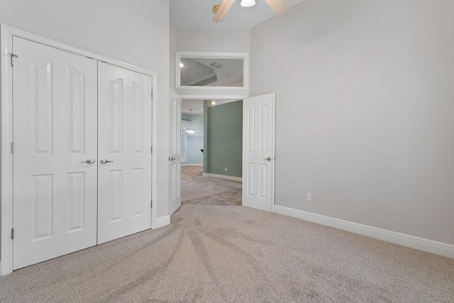 7008 Turnberry Cir, Navarre, FL 32566 - unfurnished bedroom with baseboards, ceiling fan, a closet, and carpet