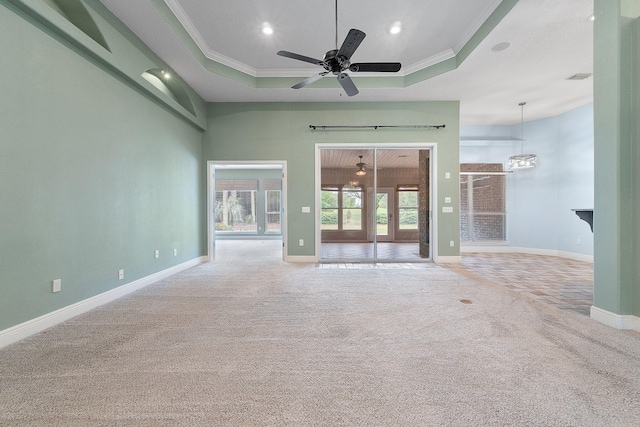 7008 Turnberry Cir, Navarre, FL 32566 - spare room featuring baseboards, a raised ceiling, ornamental molding, and carpet flooring