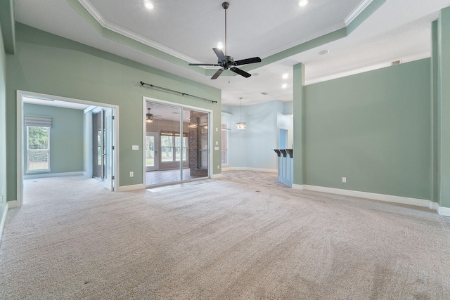7008 Turnberry Cir, Navarre, FL 32566 - spare room featuring crown molding, ceiling fan, light carpet, and plenty of natural light