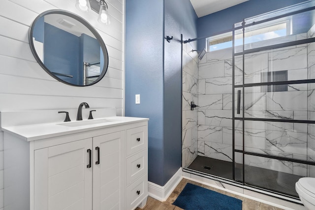 7008 Turnberry Cir, Navarre, FL 32566 - full bath featuring wood finished floors, a shower stall, toilet, and vanity