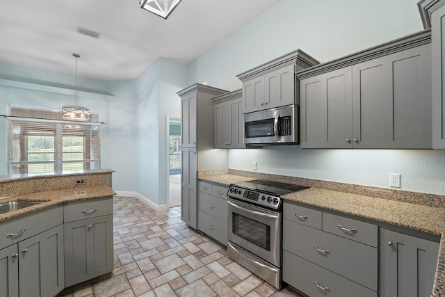 7008 Turnberry Cir, Navarre, FL 32566 - kitchen with pendant lighting, a sink, appliances with stainless steel finishes, visible vents, and gray cabinets