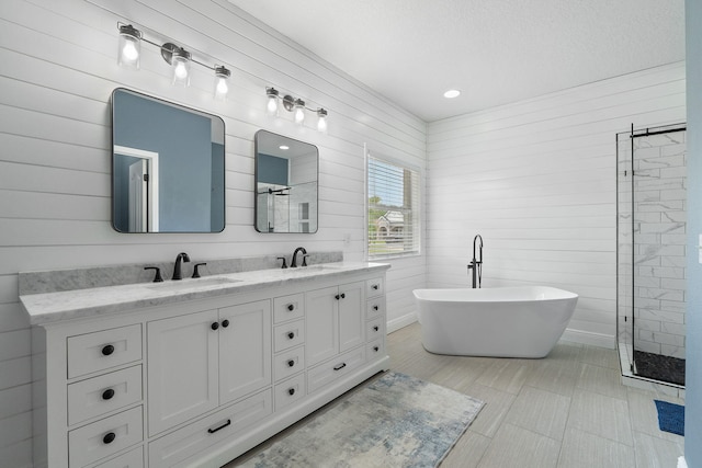 7008 Turnberry Cir, Navarre, FL 32566 - full bathroom with double vanity, a sink, tiled shower, and a soaking tub