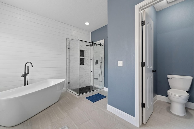 7008 Turnberry Cir, Navarre, FL 32566 - bathroom with toilet, a stall shower, a freestanding bath, baseboards, and tile patterned flooring