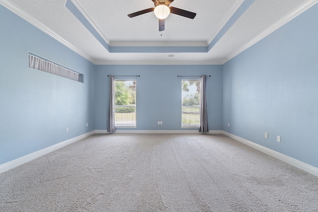 7008 Turnberry Cir, Navarre, FL 32566 - carpeted spare room with baseboards, a raised ceiling, ceiling fan, and crown molding